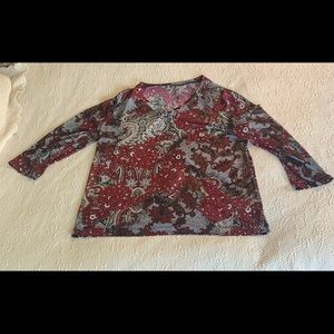 White stag, women’s medium, color is a deep red.